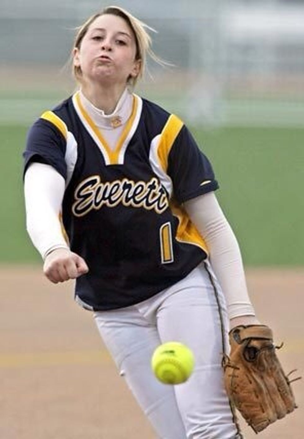 The pitcher releases the ball towards the catcher.