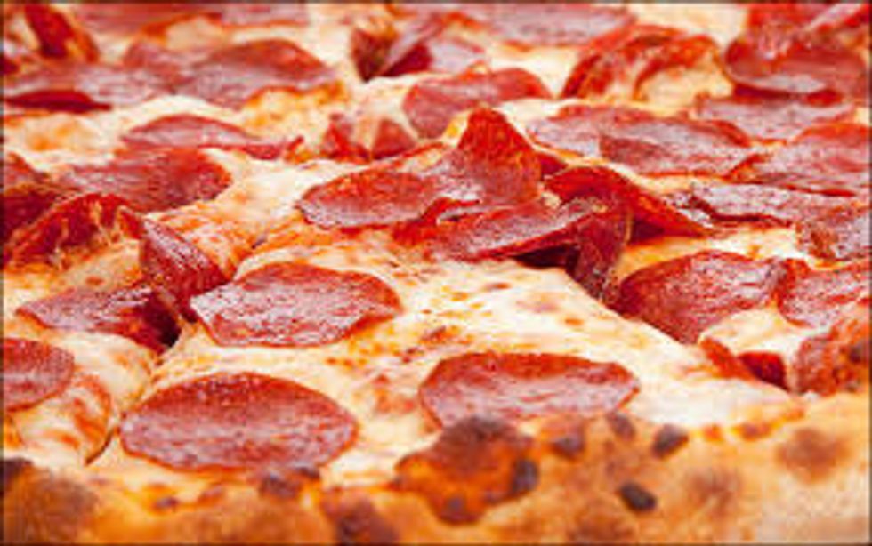 the pizza should still be hot if it is not hot then put it back in the pizza oven for 10 minutes if it is hot then let it cool for a bit till it is not super hot then put the pizza on a plate.