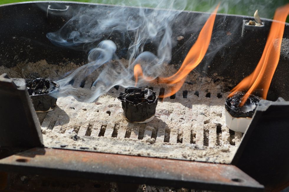 The plain wood has fizzled quickly, the commercially available waxed wood shavings are burning up too fast and the homemade wax and crumbled wood is chugging along.
