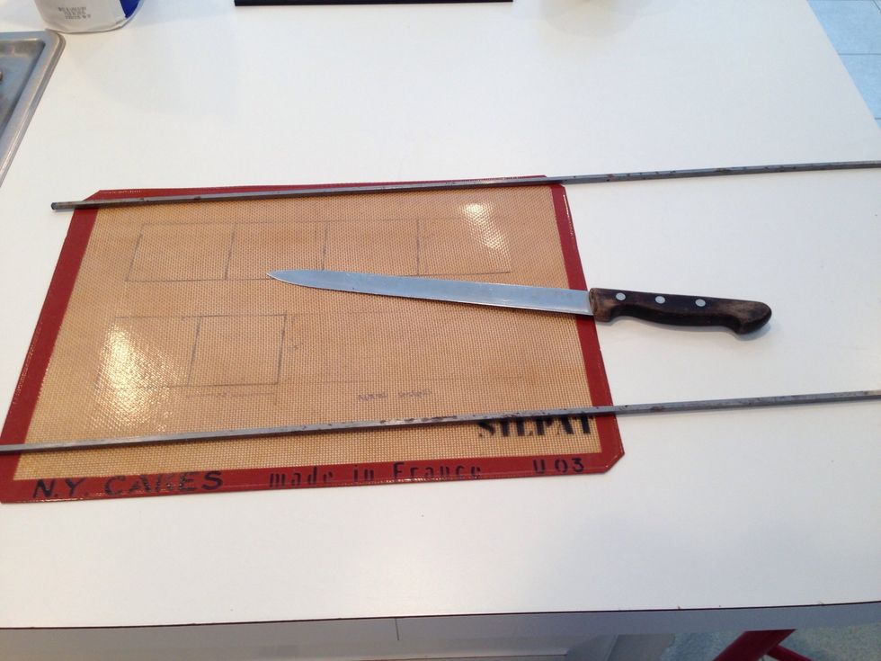 The plans are under the silpat so we can pour directly onto the pattern. We forgot to tape it down, but do that too. A lot of people bake on silpats but it smells like baking chemicals. Use paper.