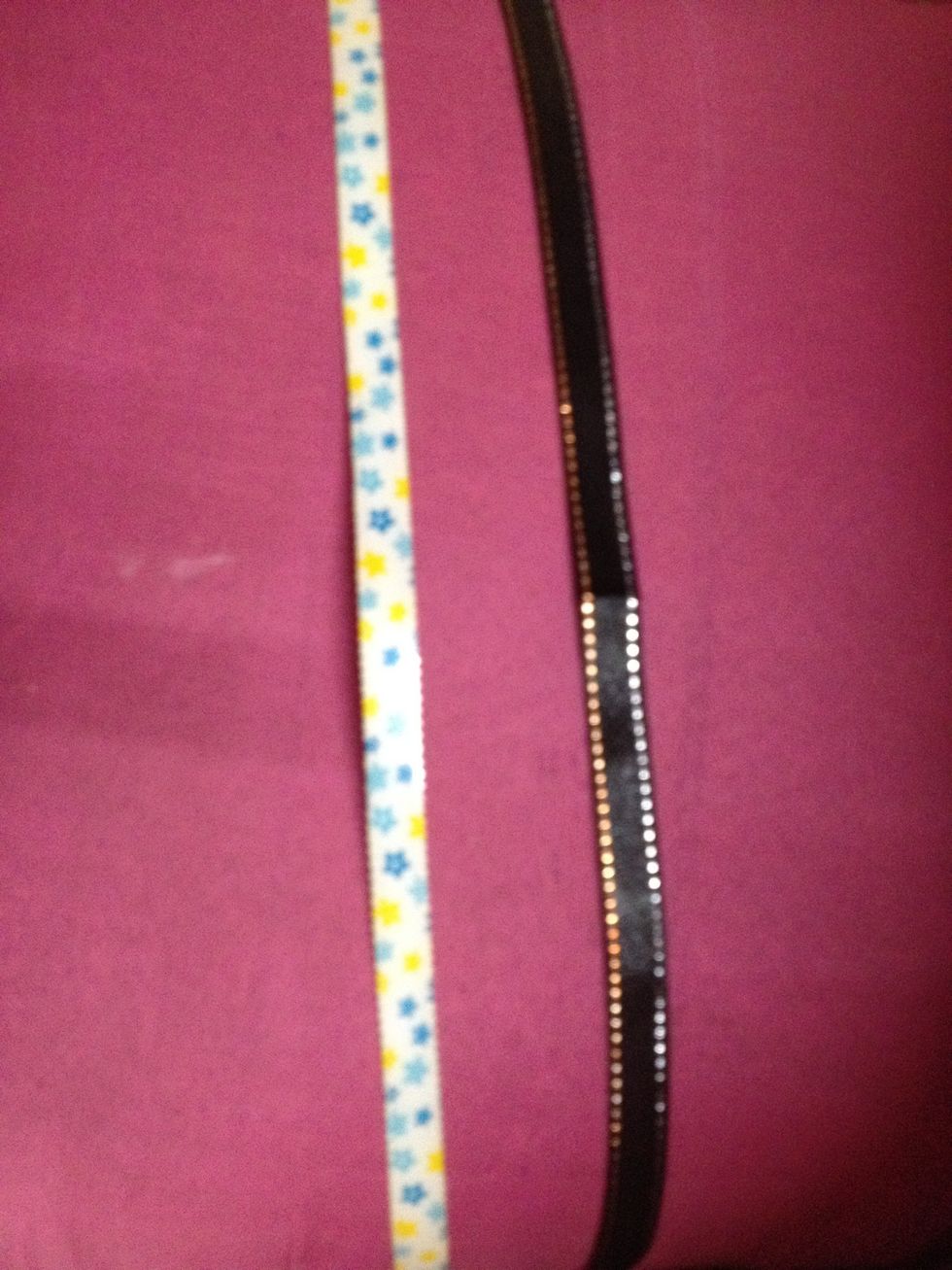 The plastic strip that came off!! I stick a black ribbon on it and leave a little ribbon to tie it at the back...