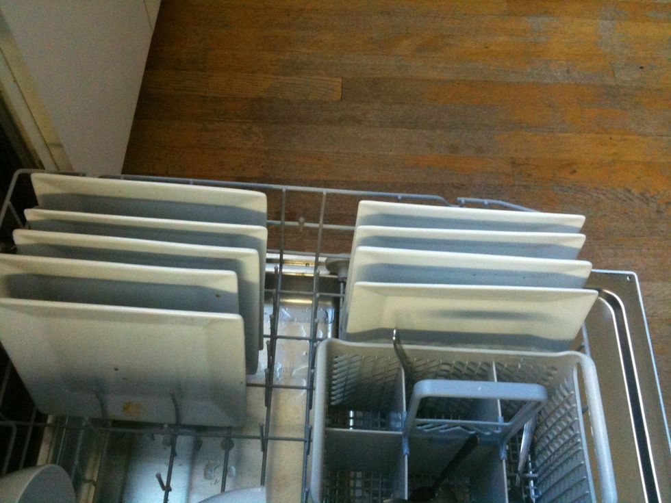 The plates slide nicely into the rack, parallel to the side of the dishwasher.
