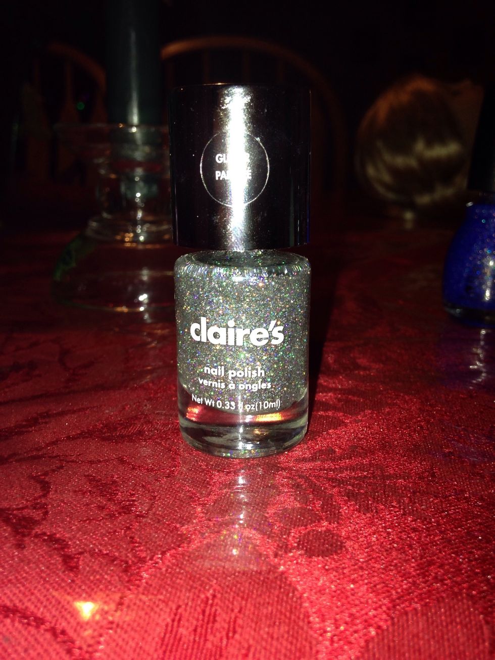 The polish in step 11 is a silver holo glitter from Claire's glitter palette. All it says is Glitter Top Coat (93983).