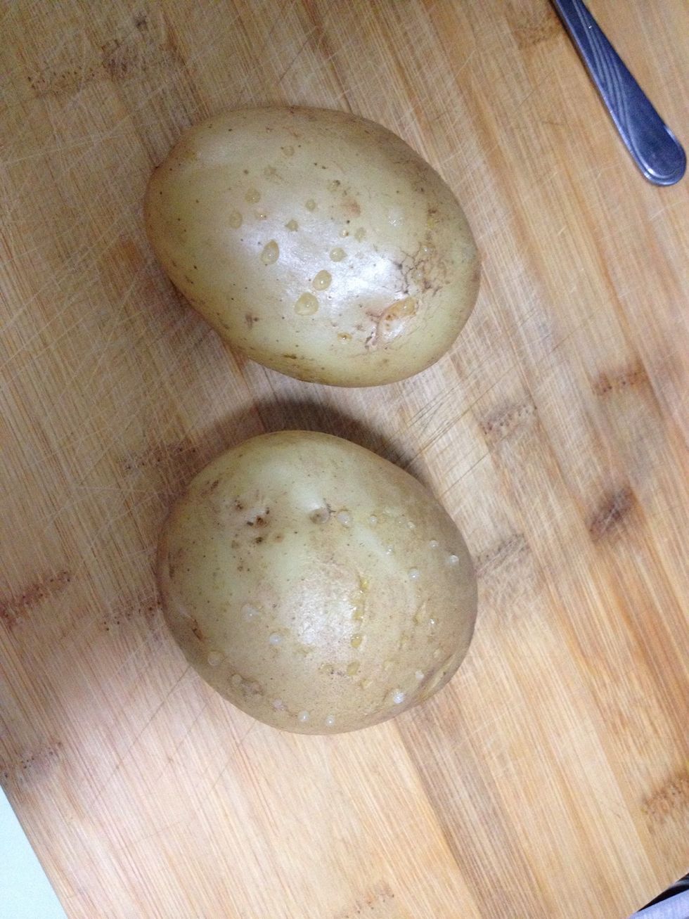 The potatoes should be hot and soft when you take them out from the microwave.