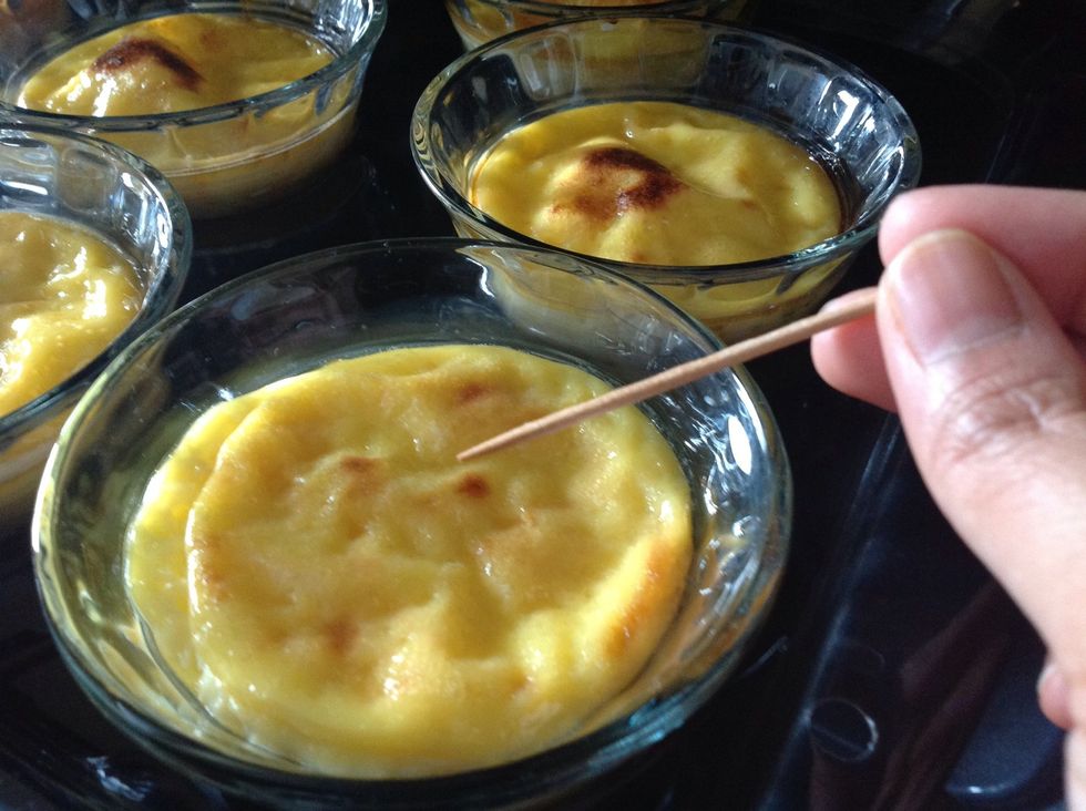 The pudding is done when a toothpick comes out clean when poked. TIP: Cover the cups with foil when put in oven, to avoid crusting.
