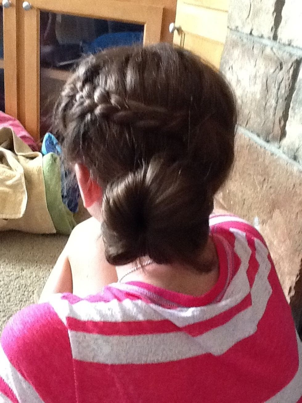 The pull the last pieces together and tie in bun