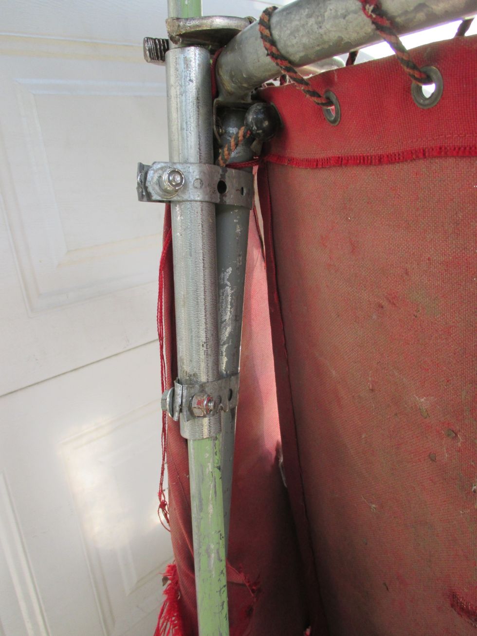 The rear 8" conduit segments are clamped just at the top o each rear upright with plumbers tape and 1" bolts. The 1/2" 3 foot tubes are inserted into where they will slide up and down.