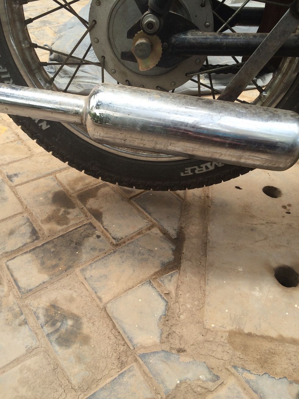 The rear wheel should be raised off the ground with considerable space for the wheel to rotate freely