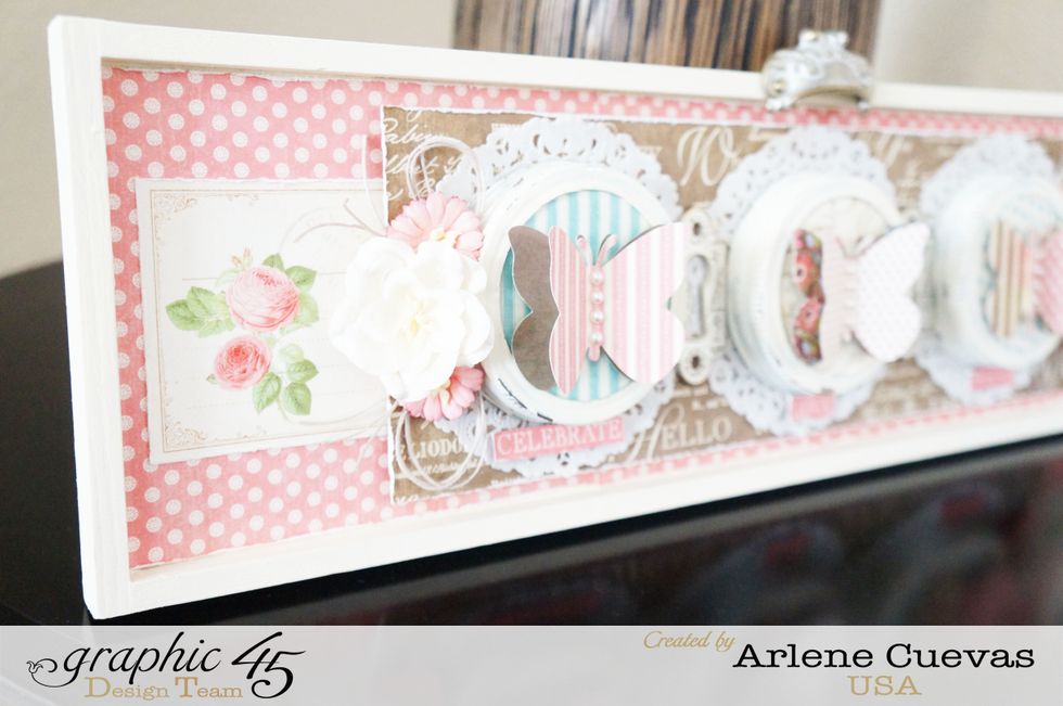 The recycled mason jar lids are such a fun touch to this sign...