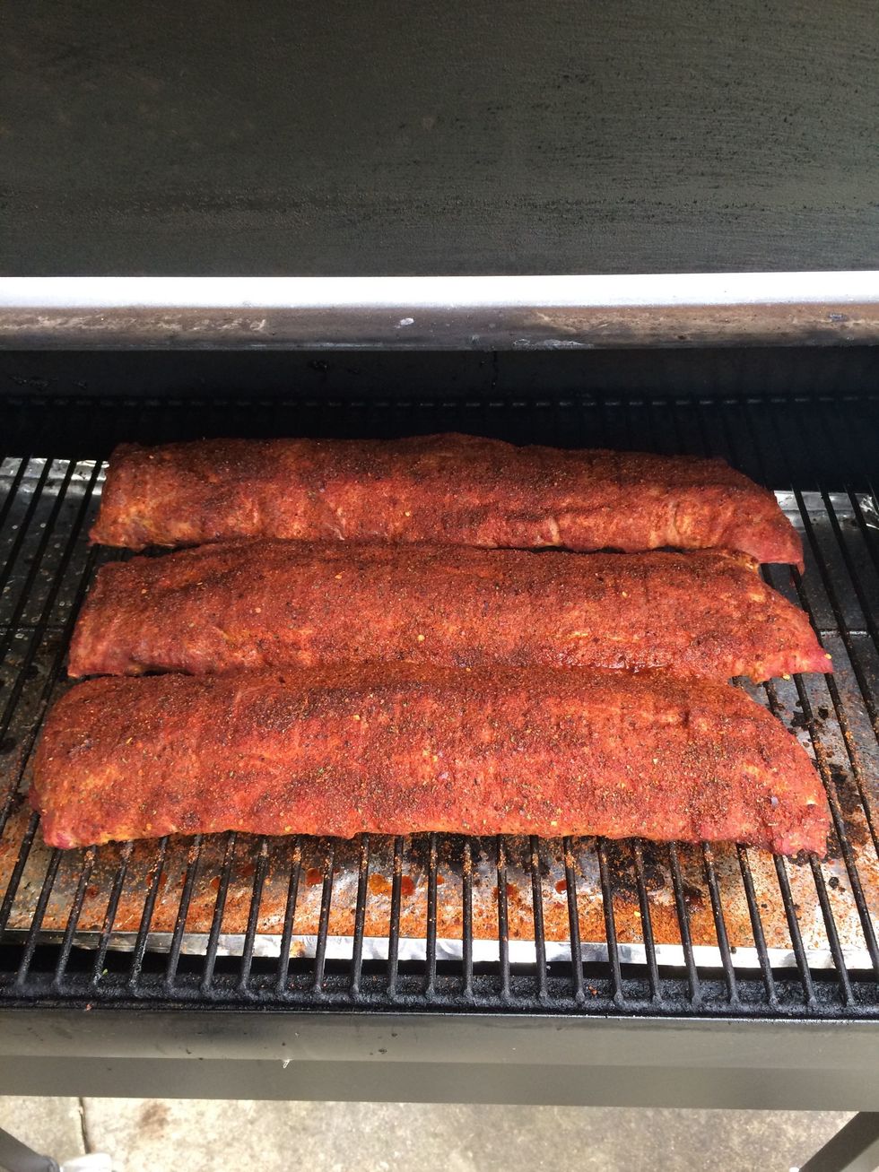 The ribs will begin to darken and dry and  get a nice texture... but don't look to much. It lets the smoke out and you want it in the meat, not in your face.