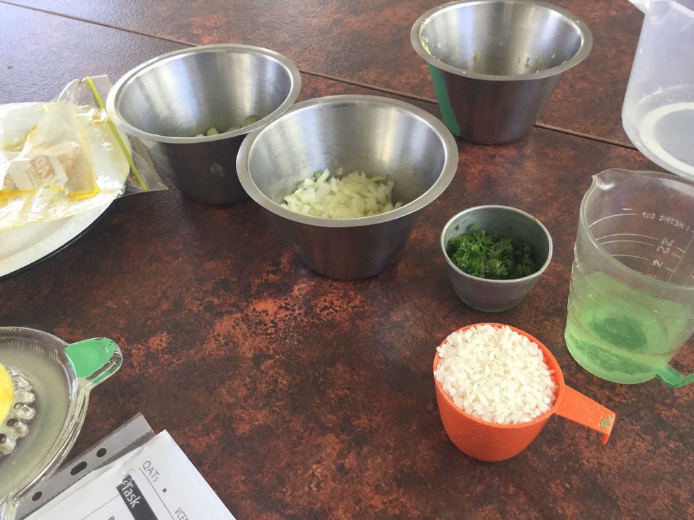 The rice is white, and the grains are small short oval shapes and are hard. The main food component in rice is starch which is a carbohydrate.