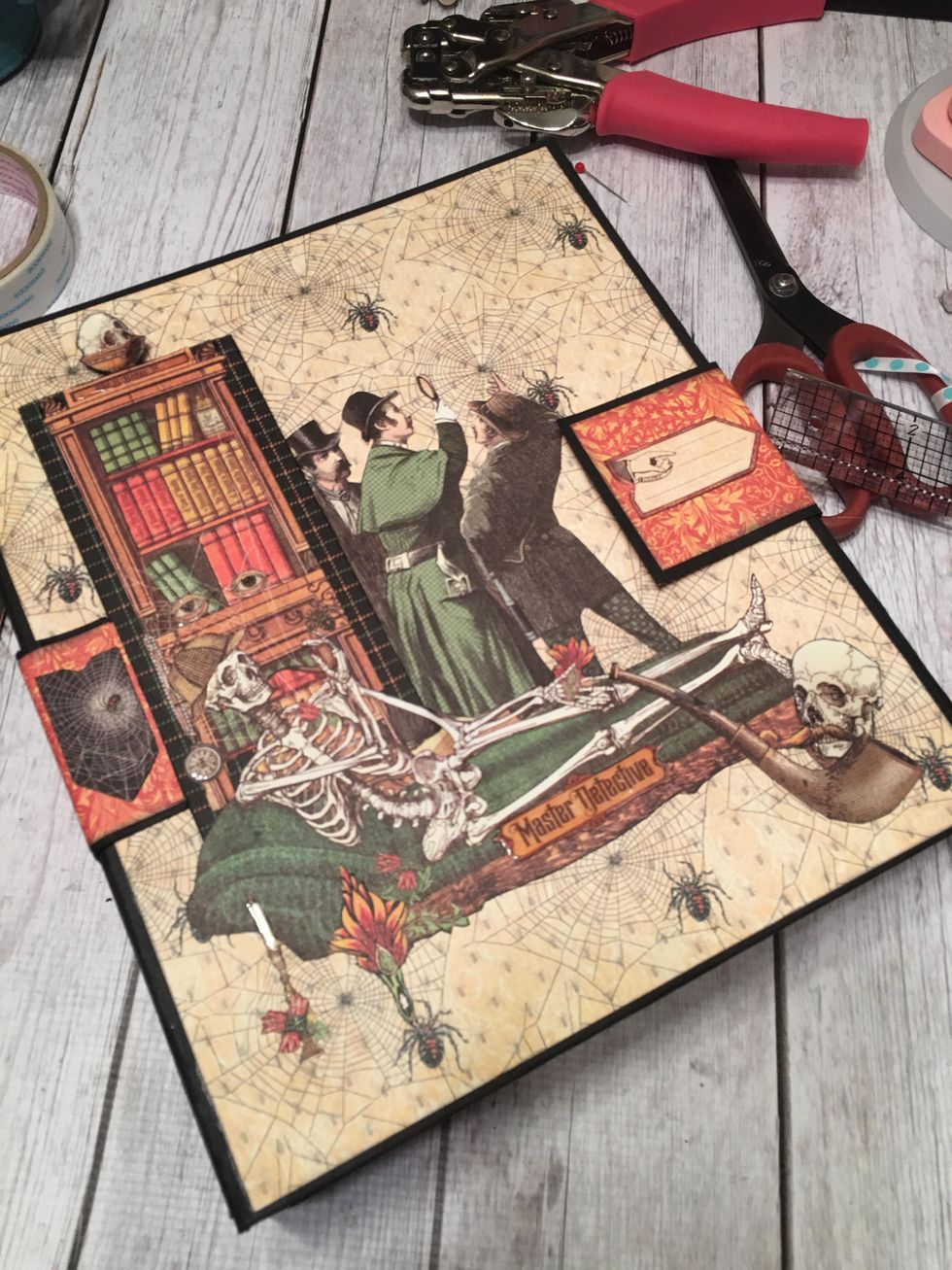 The right flap of the closure now holds the album closed with magnets.  Add sticker embellishments as shown.