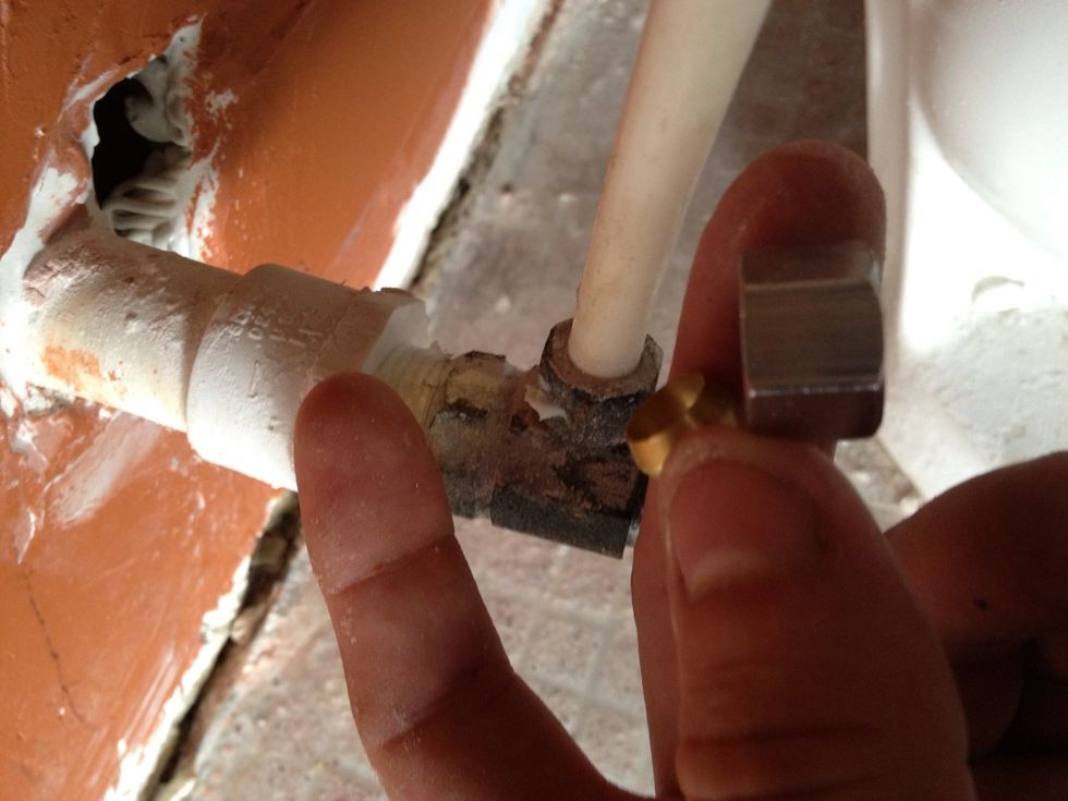 The ring adapter fits around the small plastic hose as if it was a ring and the hose was a finger. We left the existing housing in place, so we didn't use the adapter or metal collar in this guide.