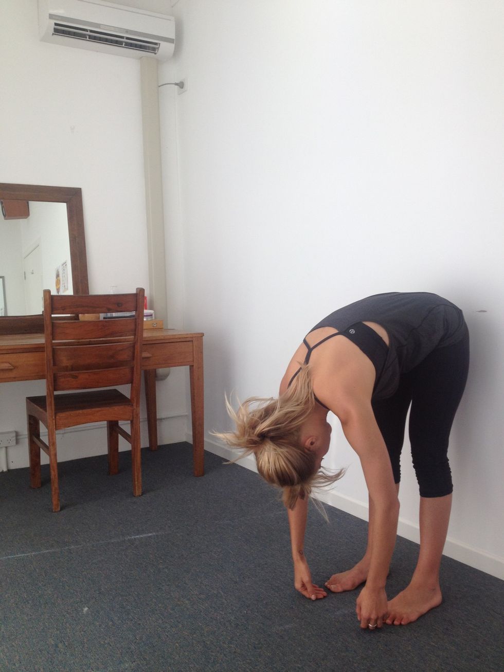 The roll down. Hips relaxed, feeling the stretch in your lower back.....