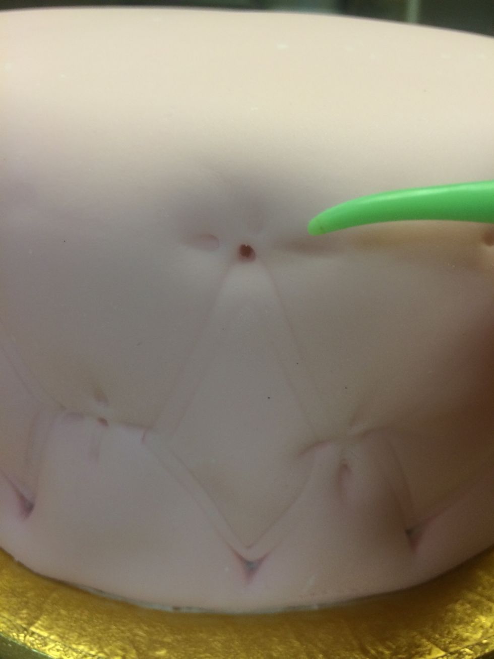 The same tool is used to create  the "dimple stitch" where the bead will sit.