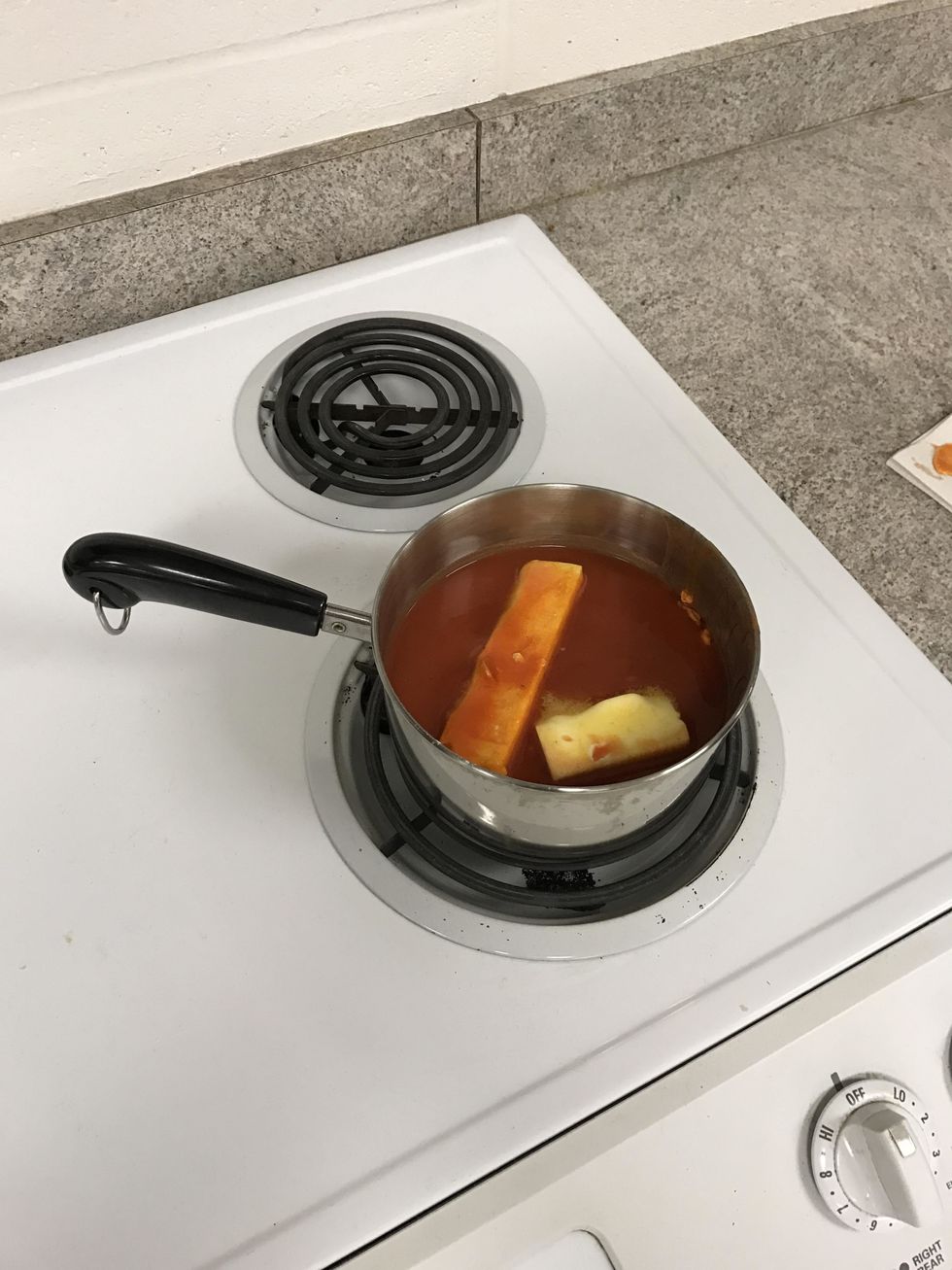 The sauce should look like this before it all melts and blends together. After all the ingredients are all melted together, you need to let the sauce come to a low simmer for a few minutes.