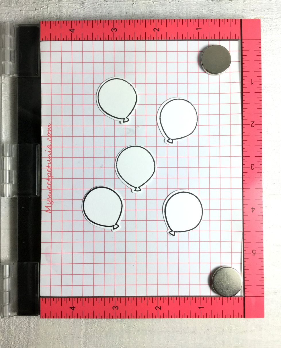 The scene could use a bit more fun and I die-cutted and stamped a few balloons.