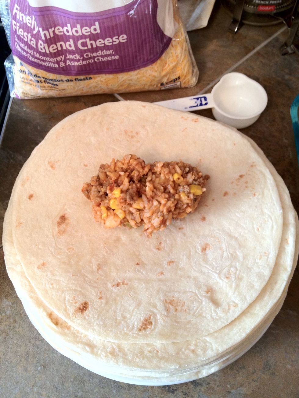 The scoop should be just above the center. This makes folding possible later.