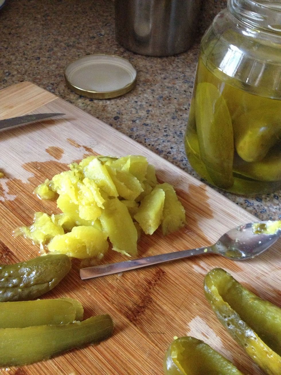 The scooped out pickle stuff stays in a pile to use with the tuna.