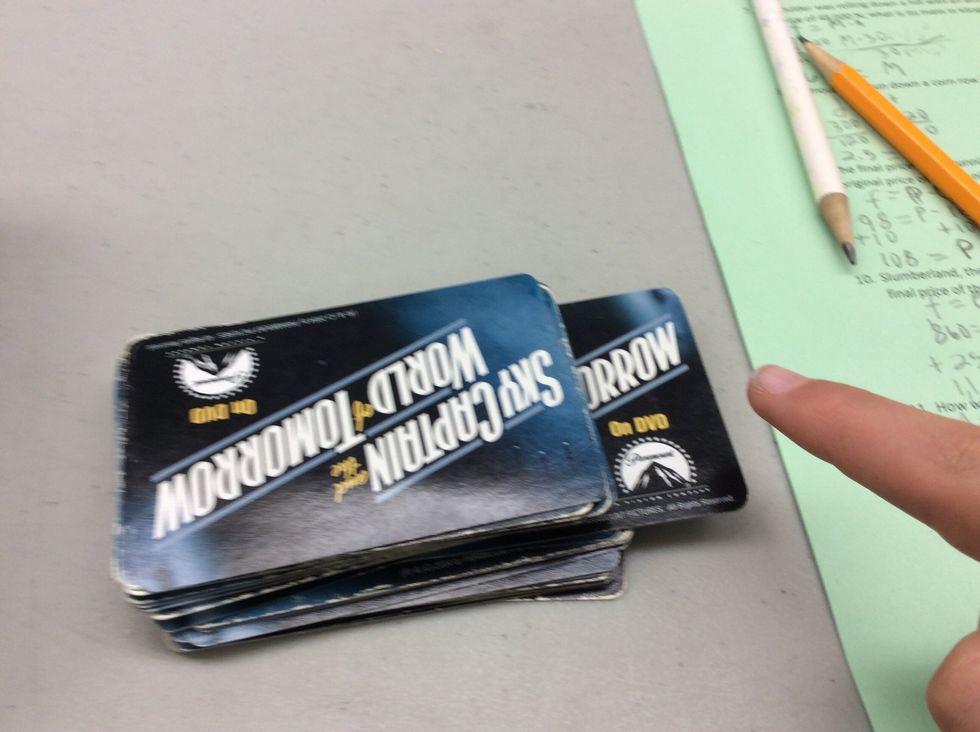 The second card goes through a door on the second floor. Put it in the middle of the stack