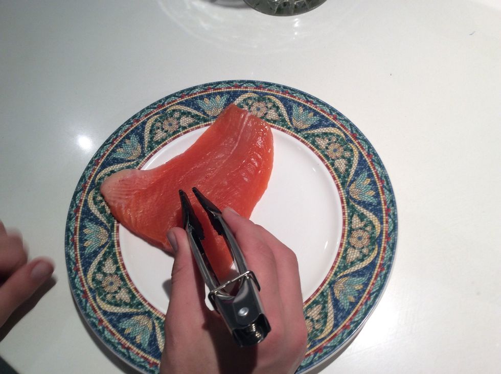 The second step is to delicately take any bones out of the salmon. This may be a fiddley and tough process.