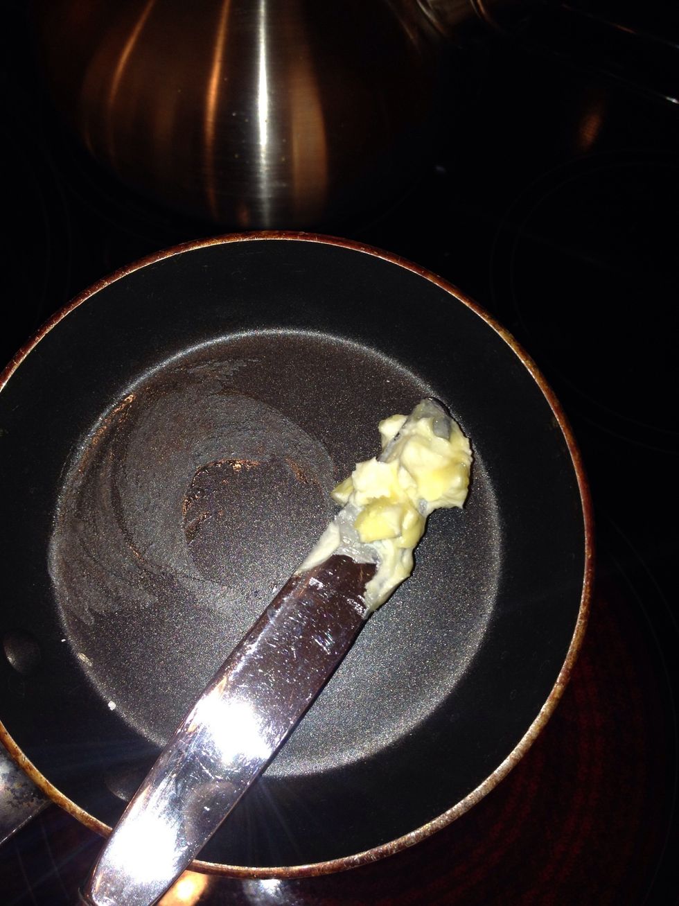 The second step is to spread butter on your pan so the egg won't stick when you try to remove your egg!