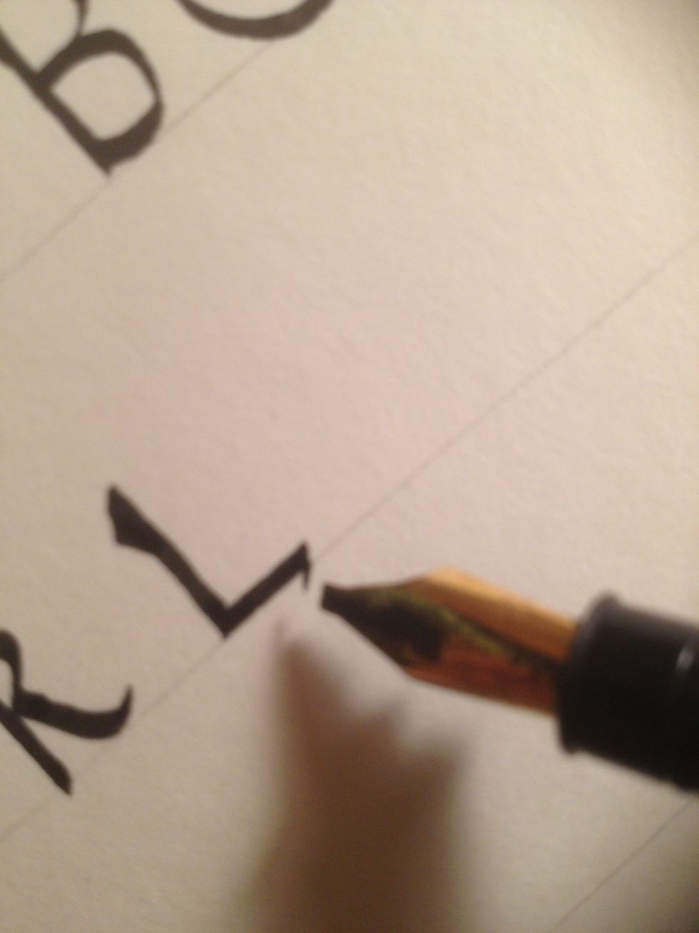 The second stroke is a straight line, with a small backward tic at the end.