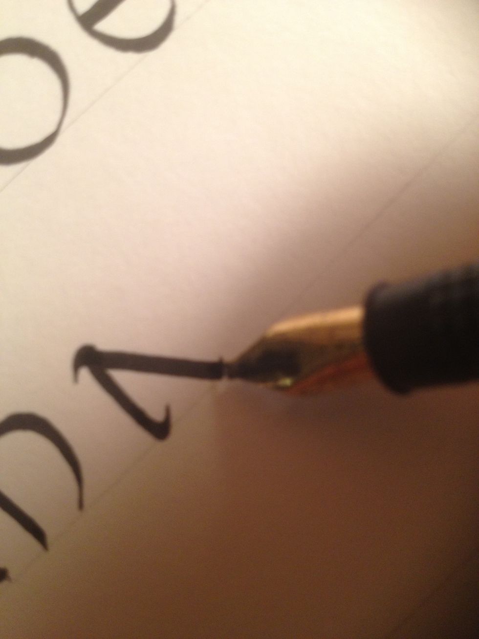 The second stroke should also curve slightly, flourishing at both ends.