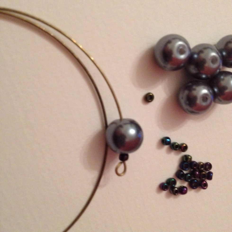 The seed bead is followed by an 8mm bead, in this case a faux glass pearl.