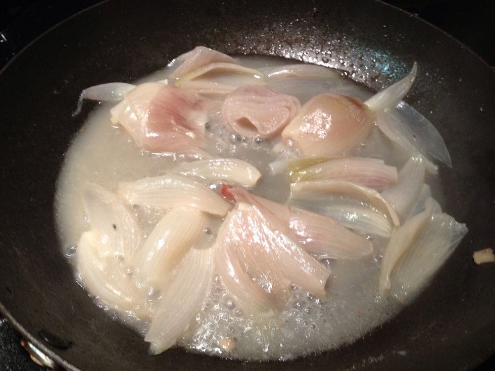 The shallots are done when the water is nearly evaporated.