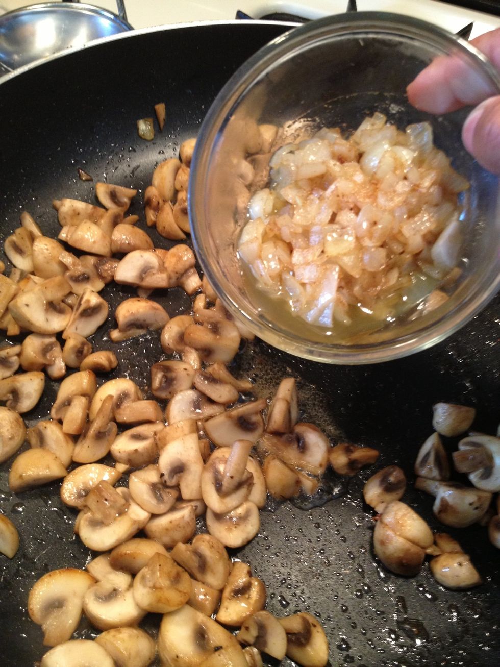 The shrooms are done now I will add the onions back to the pan.
