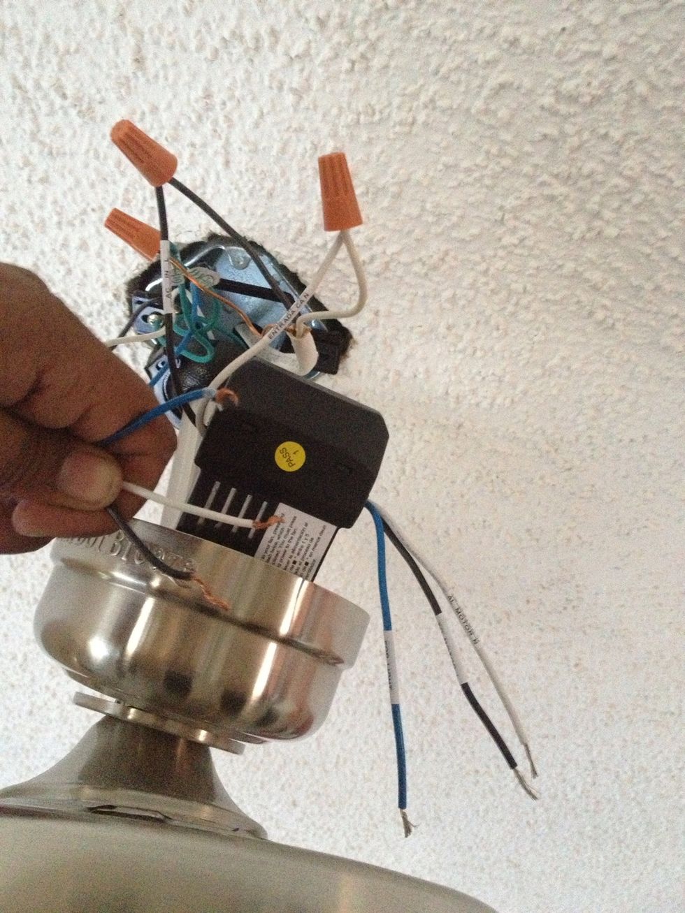 The side with 2 wires connects to the house, the side with 3 wires connects to the fan