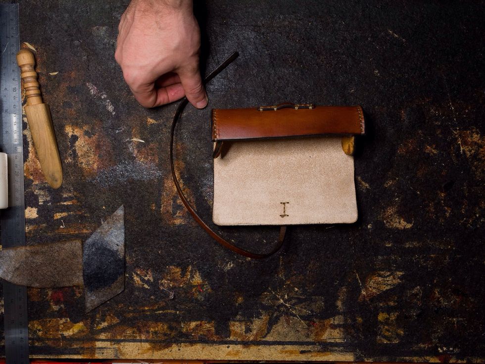 The sides have to be stitched as well before burnishing the edges again and applying any finish to the case. I used Acrylic Resolene to finish the leather.