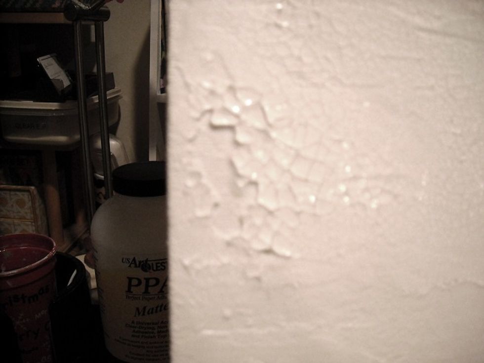 The size of crackle depends on the thickness of paste. It "grabbed" the USArt Quest molding paste! Where it was the thickest, the crackle flaked off.