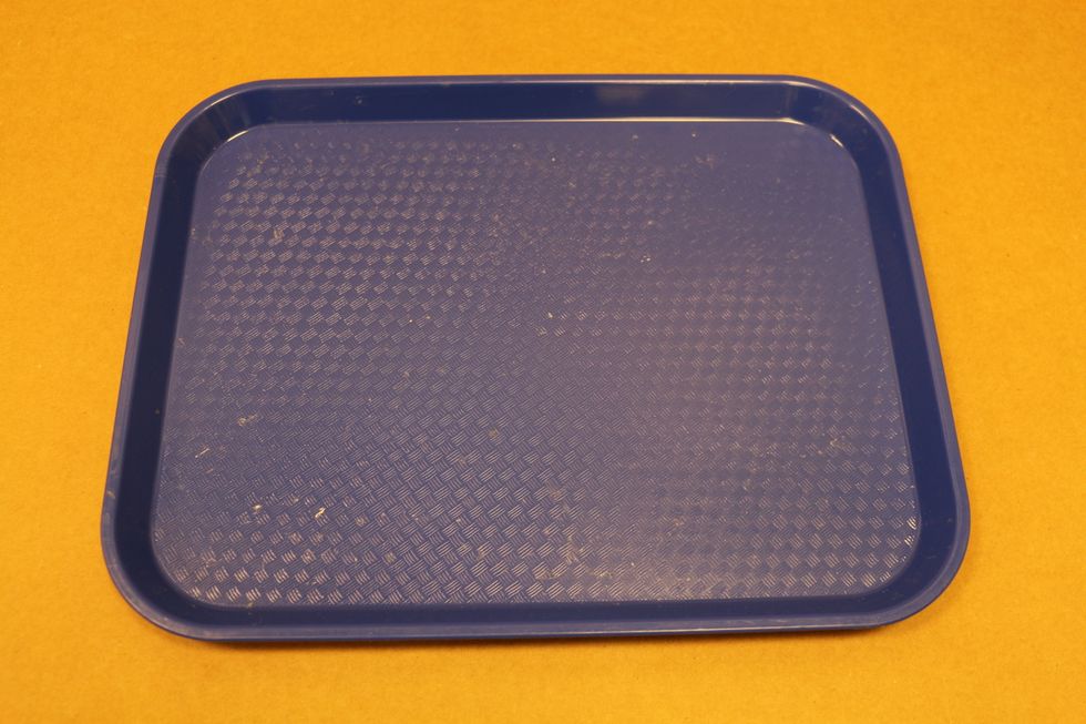 The size of the tray we use is 13.5" by 10.5". It is not too big or too small.