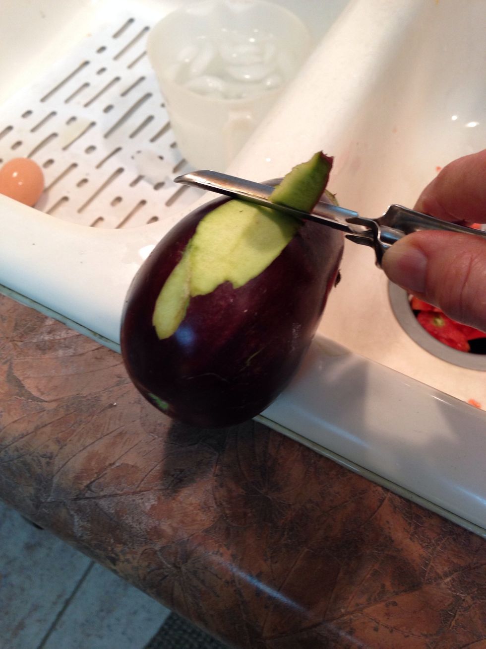 The skin is thin and shiny. Once you get the first peel off, it goes fast. I leave this step until I'm ready to coat and fry.