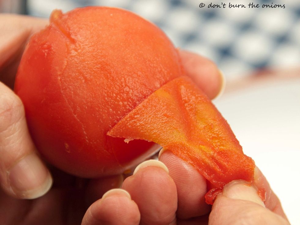 The skin should now pull away easily leaving the tomato flesh intact.