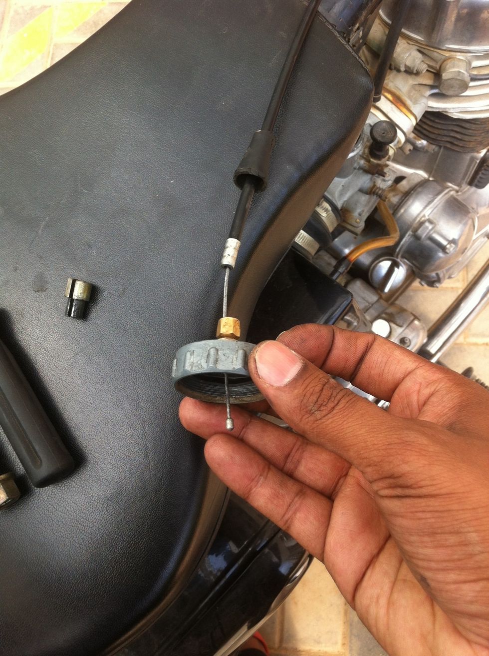 The sleeve end will seat itself into the cylinder head cable length adjuster.