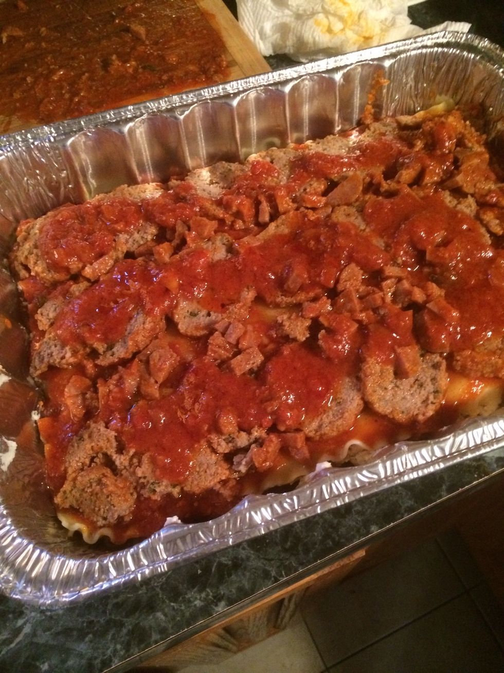 The sliced meatballs is next, add some sauce & put another 3 noodles over it when done. I sneaked in some cooked,chopped up, sweet Italian sausages( totally optional) \u263a\ufe0f