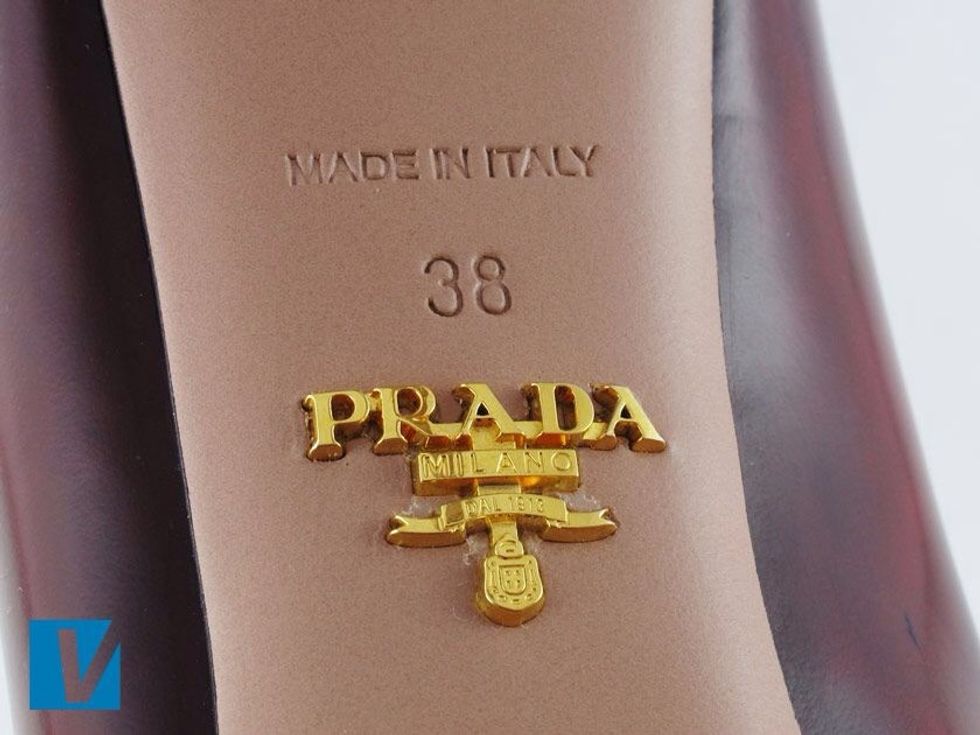 The soles of Prada heels feature the 'PRADA' logo written in capitals, or the pronounced Prada badge shaped like a T usually in gold. The size will also feature.