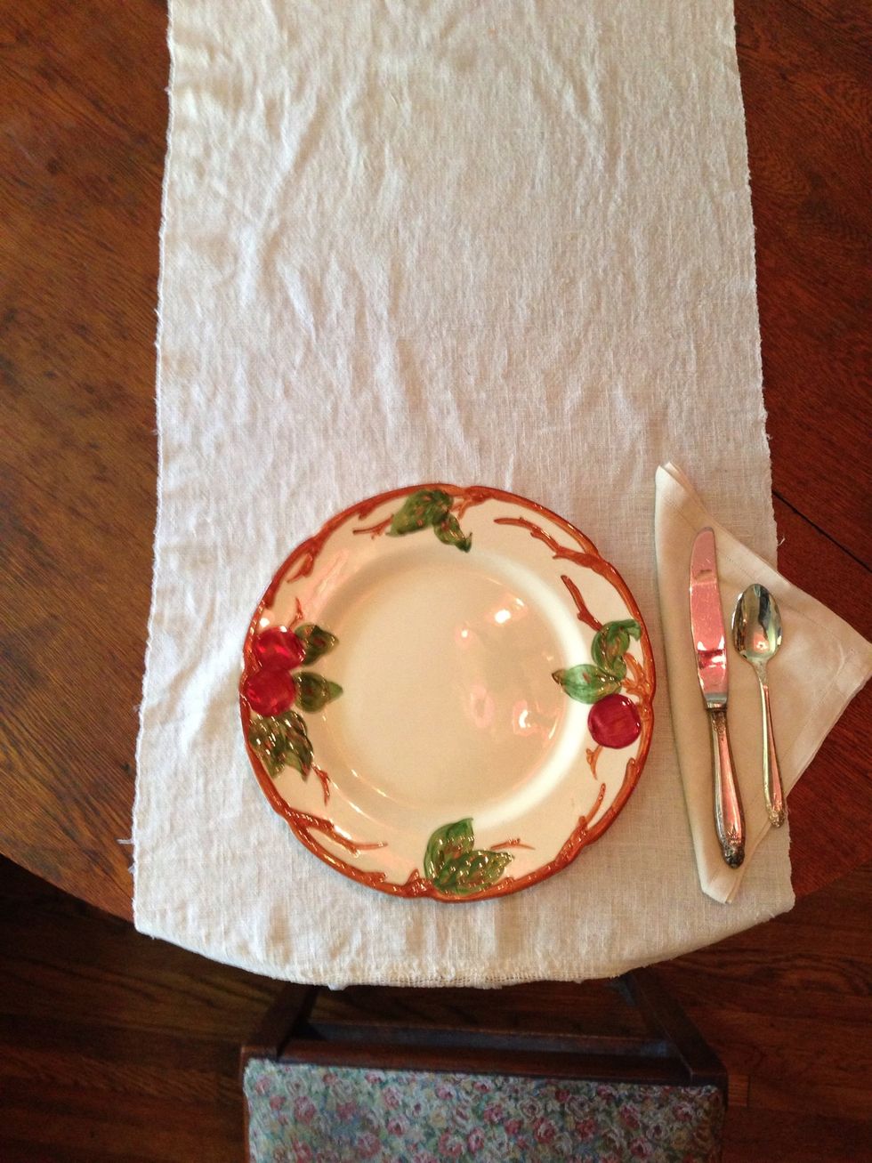 The spoon comes next, to the right of the knife.