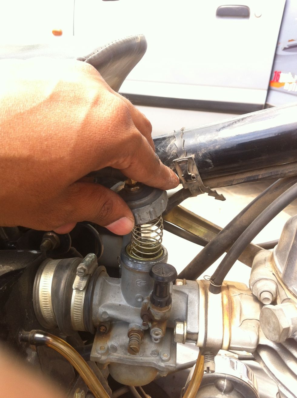 The spring will push the lid out, so be careful that all the components inside don't pop out.