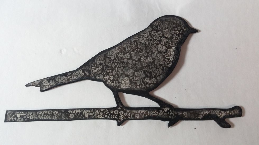 The stain and the sanding covers up any errors or extra bits of paper.