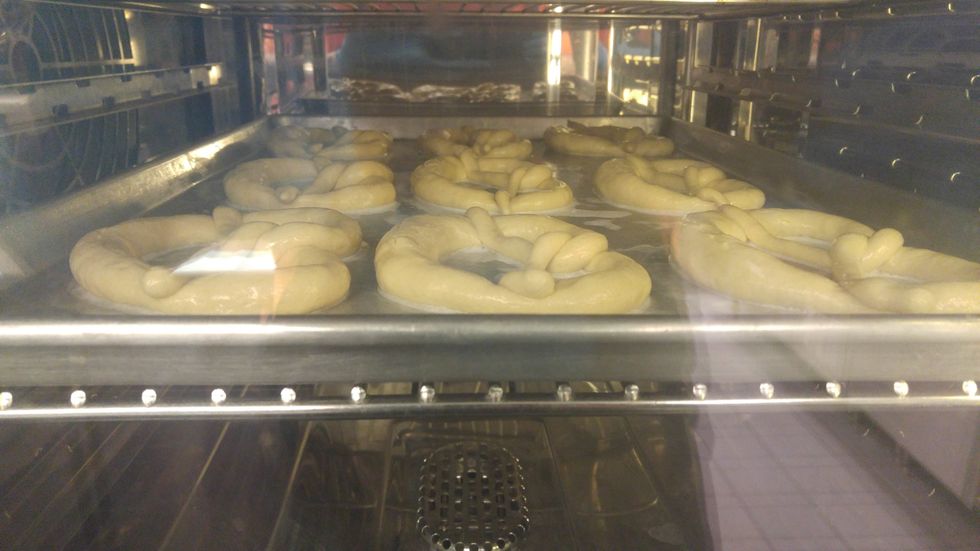 The starch gel hardens to a shiny finish, browning and flavor accumulate rapidly. The lye reacts to the carbon dioxide in the oven to form a harmless edible carbonate.