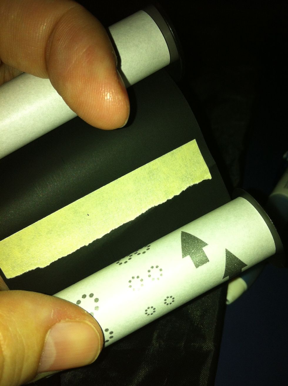 The start of the film is taped down. Your film will bunch here. Holding on to your rolls loosen the tape & allow it to restick as you roll. Check it has stuck & use extra tape if it didn't. Make sure!