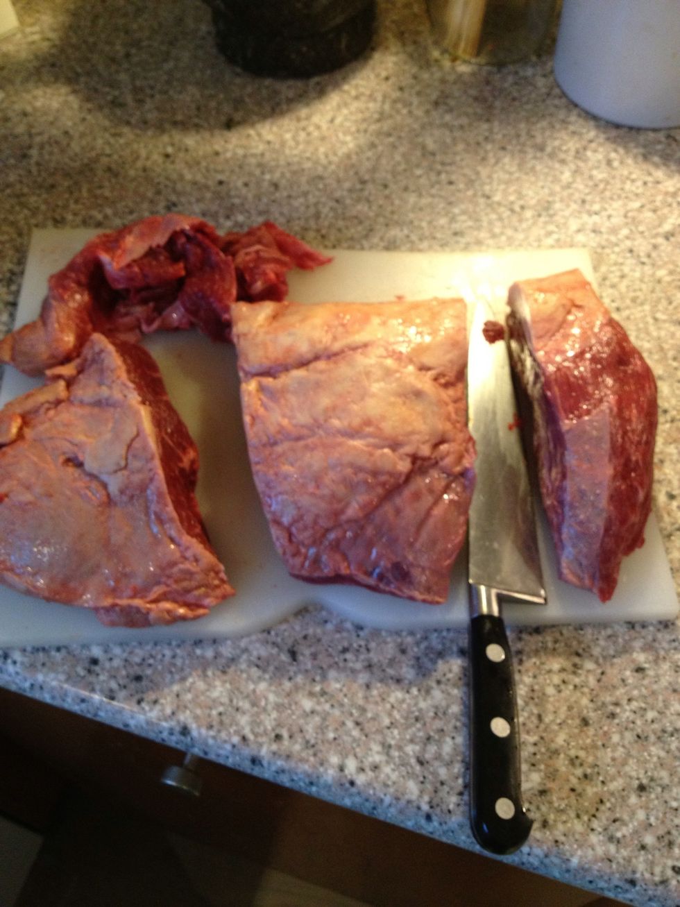 The steak cut into three parts. The tip is going to be mince, the middle is going in the oven, the top is going to be cubed and made in to a stew in the slow cooker.