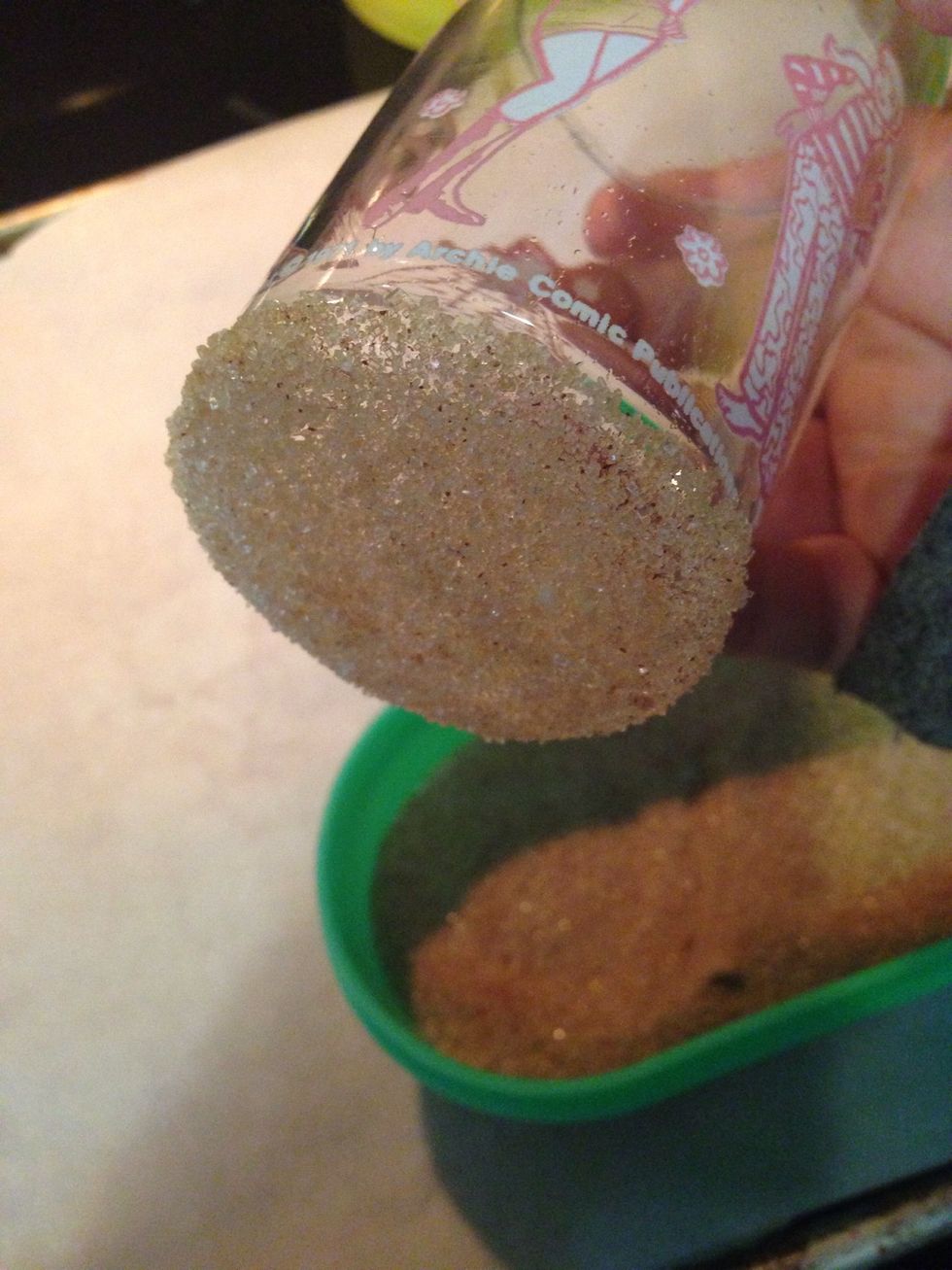 The step is optional, but perfect if you enjoy the extra spice in your cookies. Dip the bottom of a glass in sugar and cinnamon and flatten the cookie rounds.