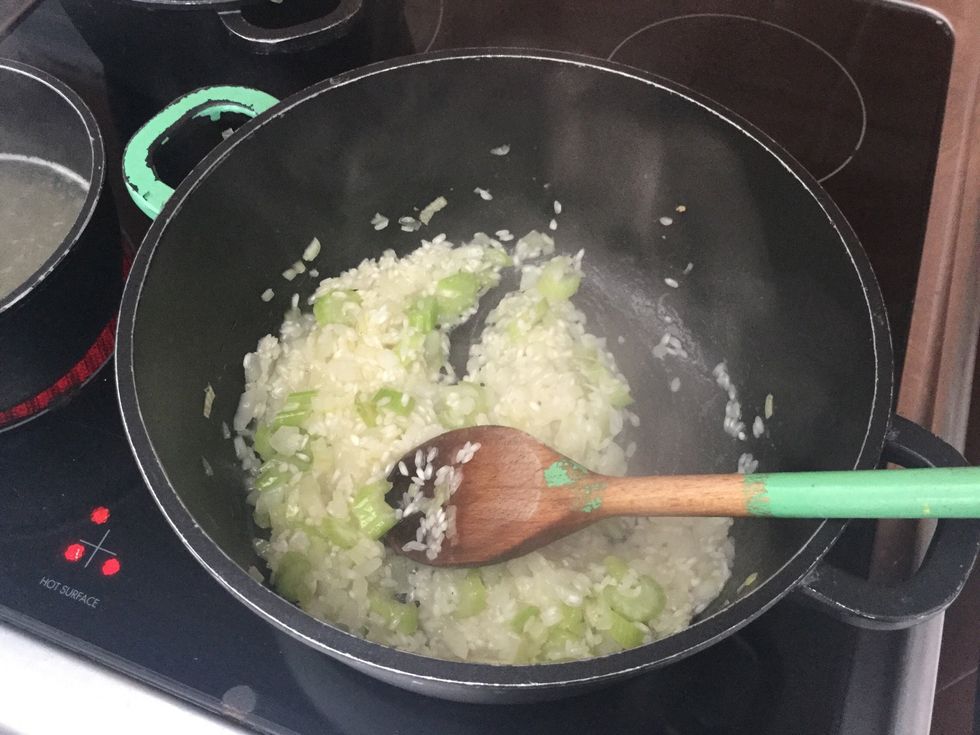 The stock is added gradually so that the rice has time to absorb the water slowly. This allows the rice to swell and soften gradually. The rice also changes colour slightly to a whiter colour.