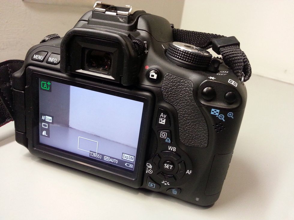 The T3i has a LiveView capability so you can use the screen to preview instead of the traditional view finder. To use LiveView, press the red button next to the view finder.