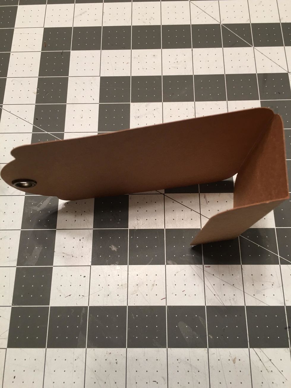 The tag will look like this with the two fold lines folded up. This makes the wrapped bottom of your tag album.